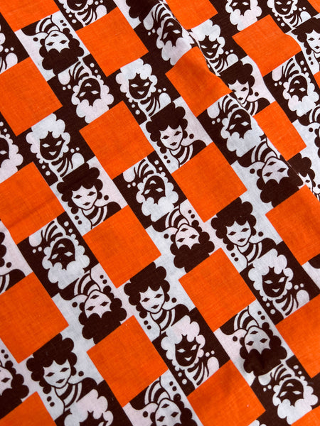 Vintage Orange Faces Novelty Print Fabric